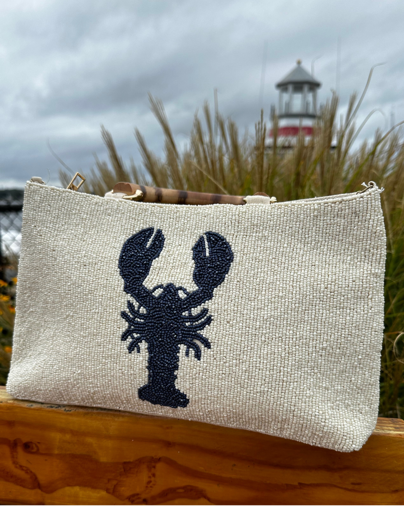 Cream Beaded Purse with Navy Lobster Design and Curved Bamboo Handles. 