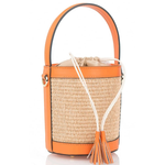 Woven handbag with orange leather accents and tassel on a white background