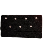 Elegant black beaded clutch with tiny pearl flowers on them -7 flowers