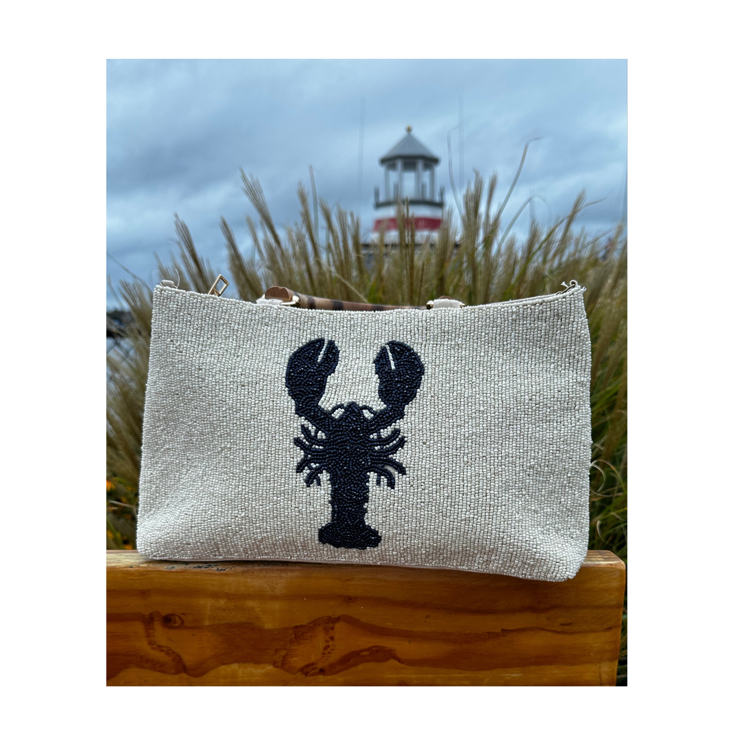 Cream Beaded Purse with Navy Lobster Design and Curved Bamboo Handles. 