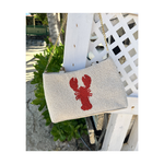 cream purse with curved bamboo handle and red lobster design