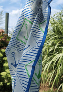 picture of silk scarf with blue, green and white anchors.
