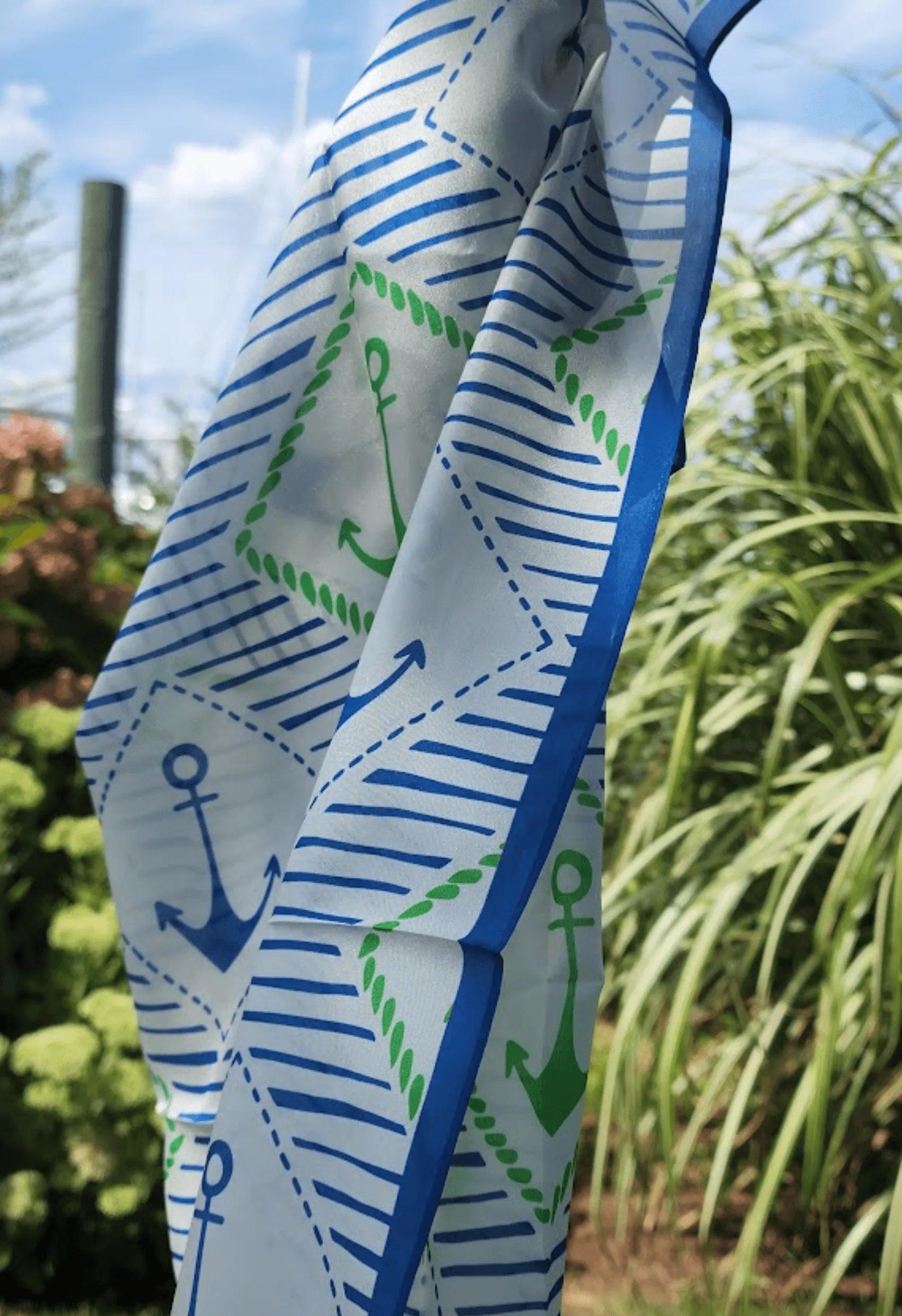 picture of silk scarf with blue, green and white anchors.