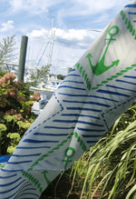 close- up picture of green anchor and blue design  on scarf