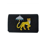 close up Black beaded structured clutchj with a leopard and umbrella design on a white background
