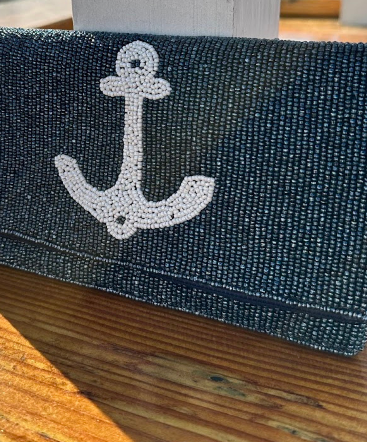 Close up of navy and white beaded clutch 