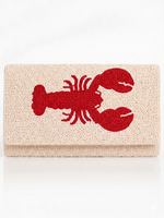 Cream Beaded clutch with red lobster design on a white background