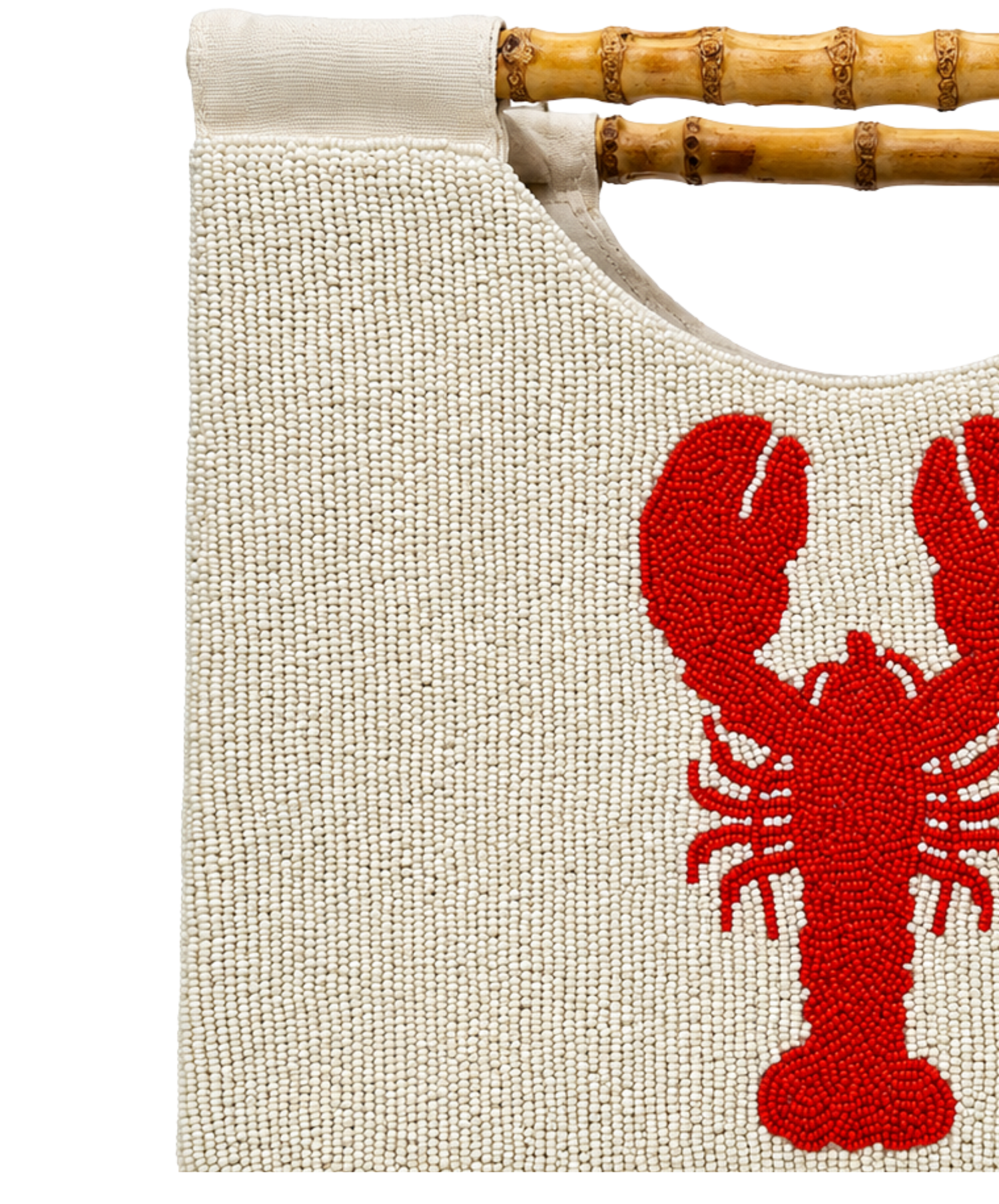 close up structured purse beaded in cream with red lobster design and straight bamboo handle on white background