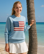 Women on beach wearing light blue sweater with American Flag.
Crew Neck sweater