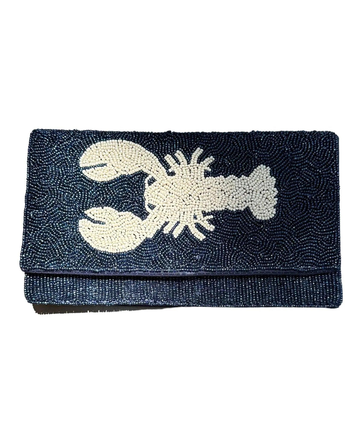 navy blue beaded clutch with white lobster design on a white background