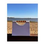Back of white beaded purse with sailboats