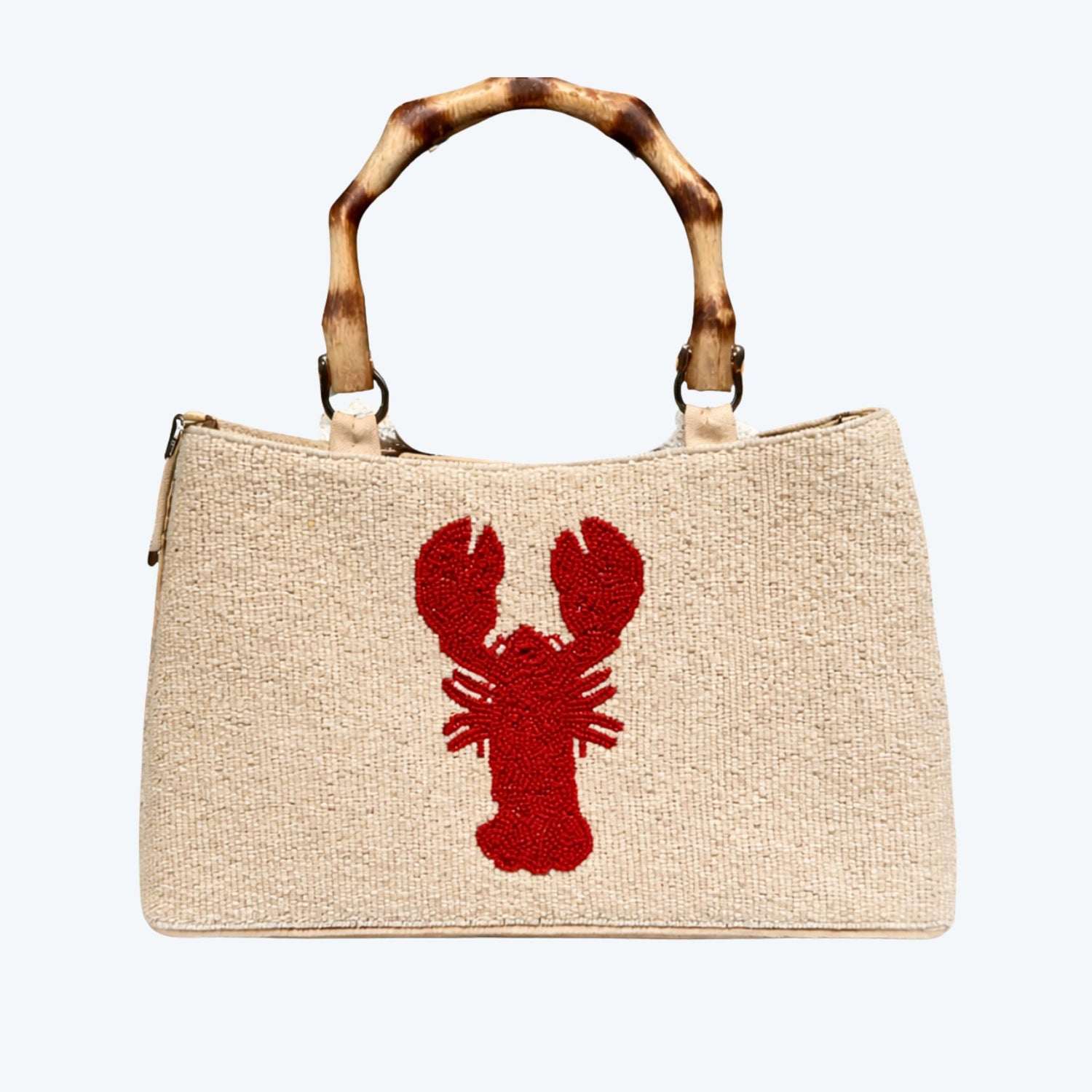 beaded cream purse with rounded bamboo handle with red lobster design.  